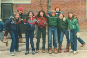 Photo of Louise on Laura's shoulders with some of our Grade 8 friends Plasticine Airplain Laura Tucker Daily Letter